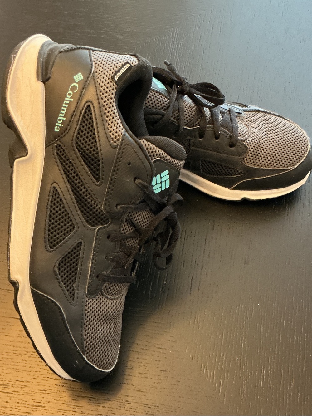 Columbia women’s Trail Shoes in Black and Gray with Teal Accent